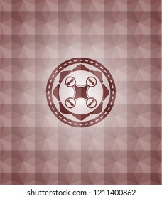 air drone icon inside red emblem with geometric background.