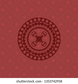 air drone icon inside red icon or emblem