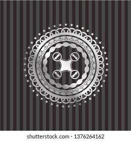 air drone icon inside silvery badge or emblem