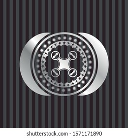 air drone icon inside silvery badge or emblem