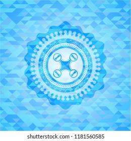 air drone icon inside sky blue emblem. Mosaic background