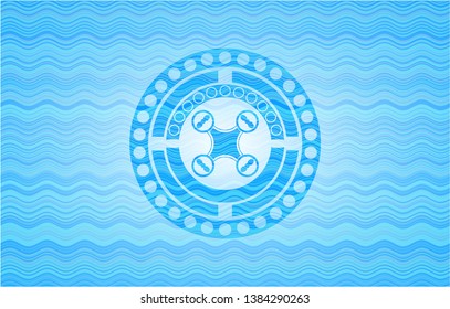 air drone icon inside sky blue water wave emblem.