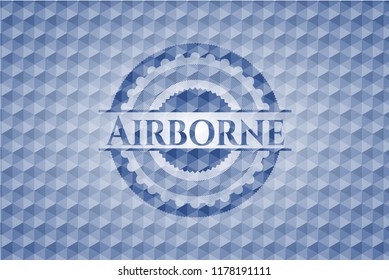 Airborne blue emblem with geometric pattern background.