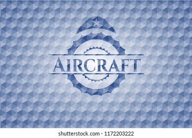 Aircraft blue emblem or badge with abstract geometric pattern background.