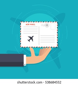 Airmail vector illustration. Hand holding an envelope with postal stamp. Air mail delivery flat icon. Vector illustration