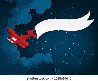 Airplane aerial view paper art with paper banner for text. Flying origami red plane. Night sky background with fluffy clouds and stars. Trendy paper art style