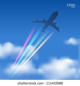 Avión en un cielo azul con nubes y colores multicolores