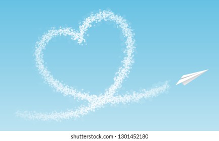 Airplane flies a cloud heart in front of blue sky