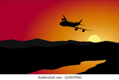 airplane flying in sunset