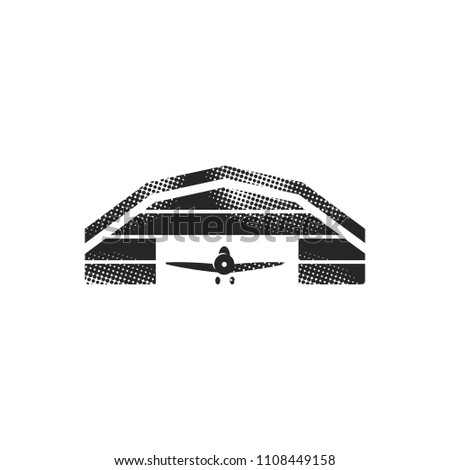 Airplane hangar icon in halftone style. Black and white monochrome vector illustration.