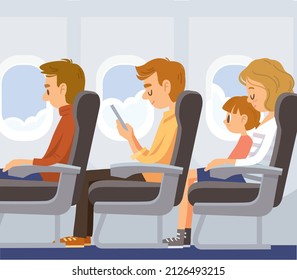 Airplane passengers sitting on their seats at cabin on a plane flight. flying by plane