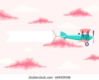 Airplane with pilot and advertising banner in the cloudy sky