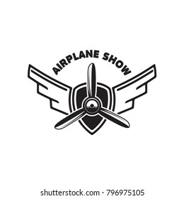 Airplane show. Retro airplane propeller on winged emblem. Design element for logo, label, emblem, sign. Vector illustration