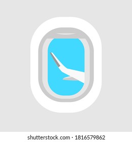Airplane window. View of the airplane wing from inside the aircraft cabin