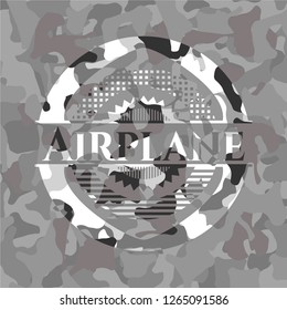Airplane written on a grey camouflage texture