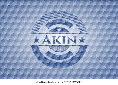 Akin blue badge with geometric pattern background.