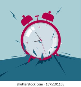 The alarm clock broke through the ground. Isolated on blue background.