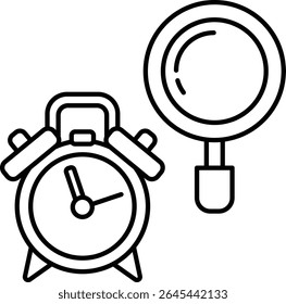 A alarm clock with a handle sits next to a magnifying glass
