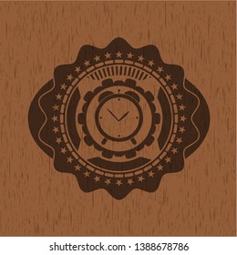 alarm clock icon inside badge with wood background