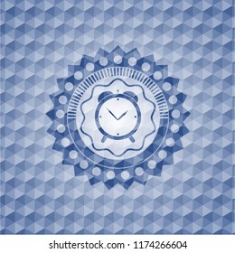 alarm clock icon inside blue emblem or badge with abstract geometric pattern background.