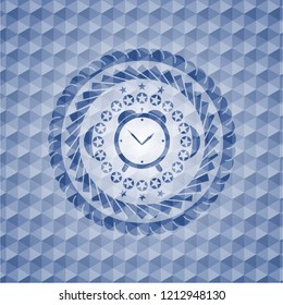 alarm clock icon inside blue emblem or badge with geometric pattern background.