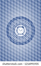 alarm clock icon inside blue emblem or badge with geometric pattern background.