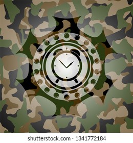 alarm clock icon inside camouflaged emblem