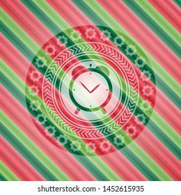 alarm clock icon inside christmas style emblem.