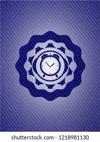 alarm clock icon inside denim background