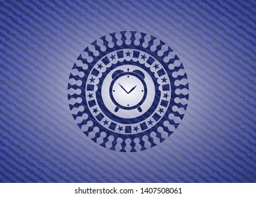 alarm clock icon inside denim background