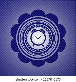 alarm clock icon inside emblem with denim high quality background