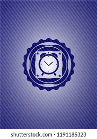 alarm clock icon inside emblem with jean texture