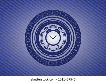 alarm clock icon inside emblem with jean background