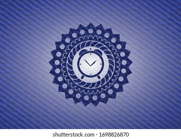 alarm clock icon inside emblem with jean background