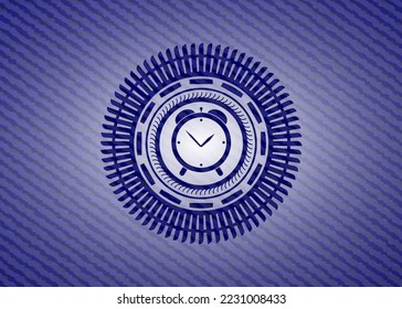 alarm clock icon inside emblem with jean background. 