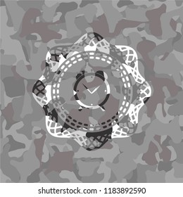 alarm clock icon inside grey camo texture