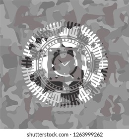 alarm clock icon inside grey camo texture