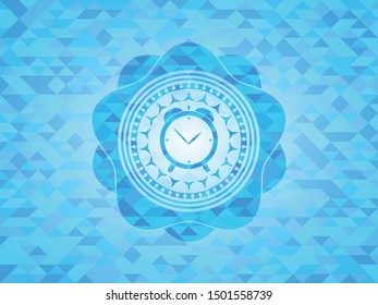 alarm clock icon inside light blue mosaic emblem