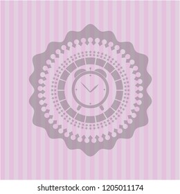 alarm clock icon inside pink emblem