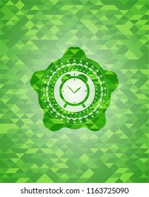 alarm clock icon inside realistic green mosaic emblem