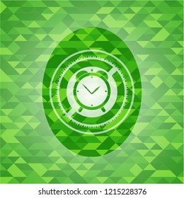 alarm clock icon inside realistic green emblem. Mosaic background