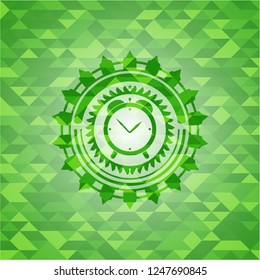 alarm clock icon inside realistic green mosaic emblem