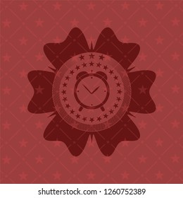 alarm clock icon inside red emblem