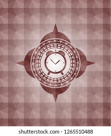 alarm clock icon inside red seamless geometric badge.