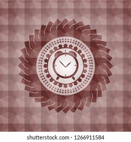 alarm clock icon inside red seamless emblem or badge with abstract geometric pattern background.