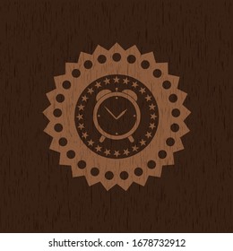 alarm clock icon inside retro wood emblem