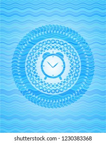 alarm clock icon inside water wave badge.