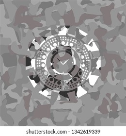 alarm clock icon on grey camouflaged pattern