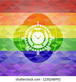 alarm clock icon on mosaic background with the colors of the LGBT flag