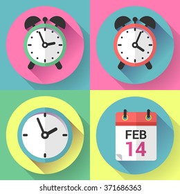 Alarm clock, office clock and calendar with a date of Valentines Day. 